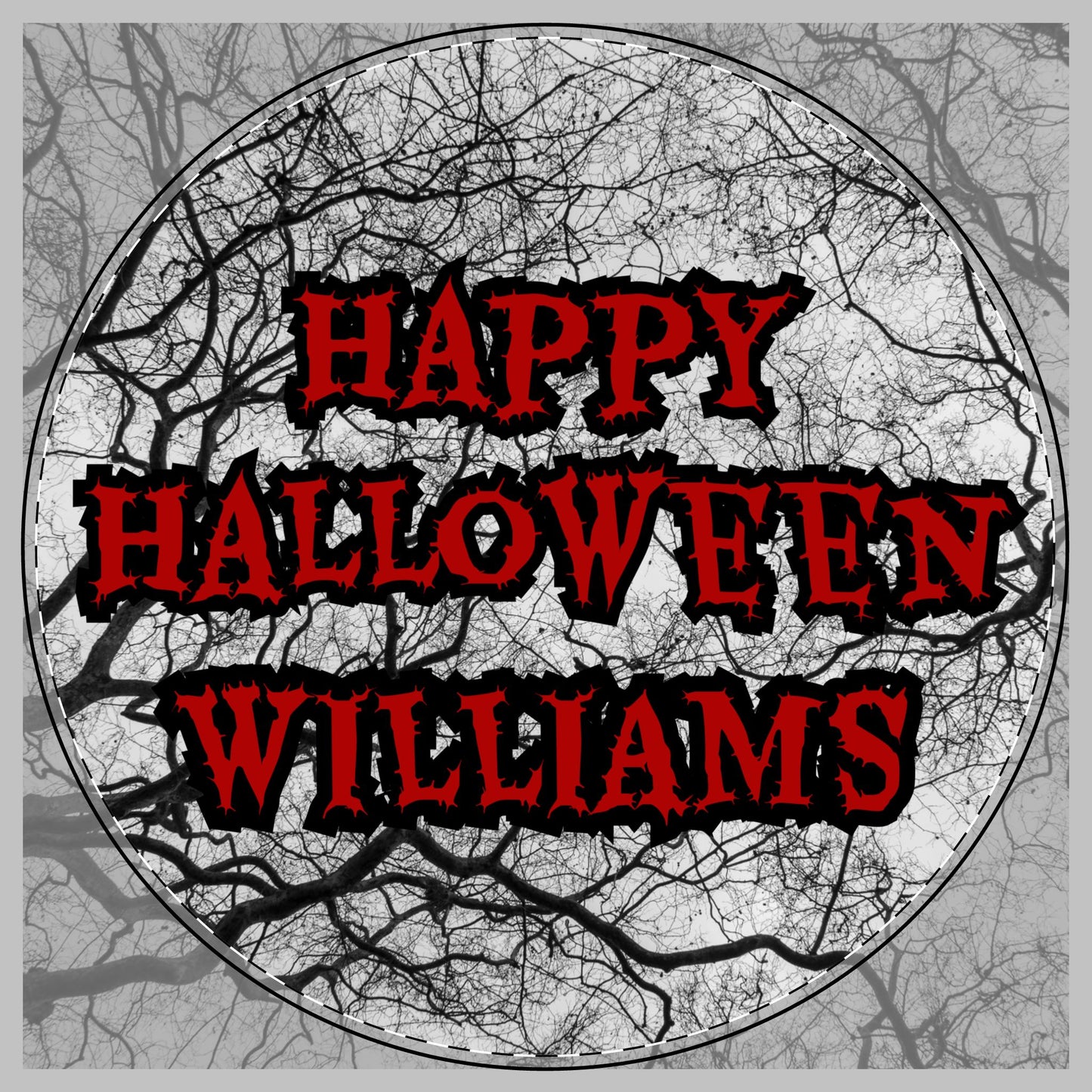 A round Halloween-themed graphic with the phrase “HAPPY HALLOWEEN WILLIAMS” in large red letters with black outlines, centered inside a circular frame over a grayscale background of bare tree branches on a cutting board.