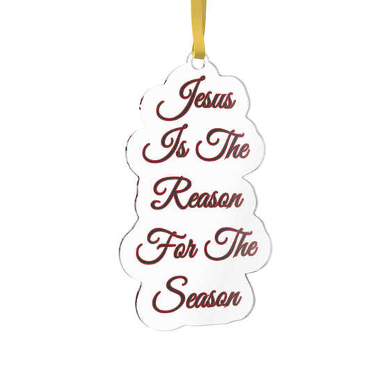 A white custom-shaped Christmas ornament with the phrase 'Jesus Is The Reason For The Season' as an example written in dark red cursive text, hanging from a gold ribbon on a white background.