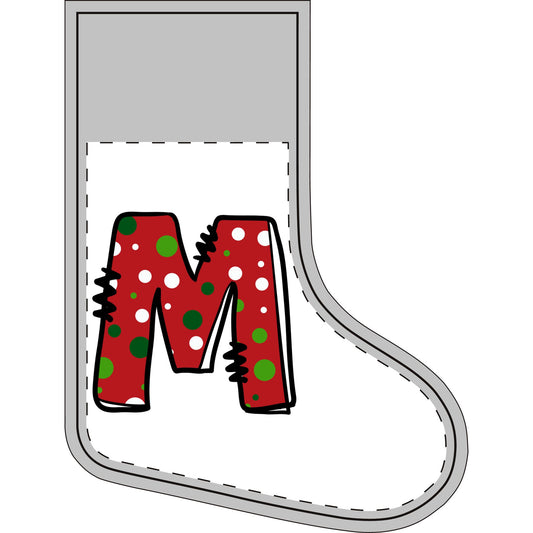 A Christmas stocking with white interior, and a large letter M filled with a red holiday pattern of green and white polka dots.