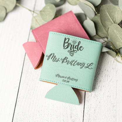 A mint green faux-leather can cooler with custom black text reading 'Bride Mrs. Brittany L.