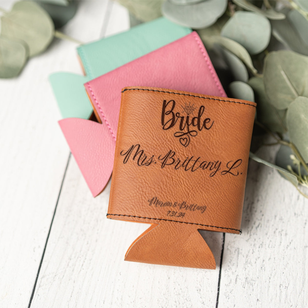 A personalized tan leather can cooler with the custom words 'Bride Mrs. Brittany L.