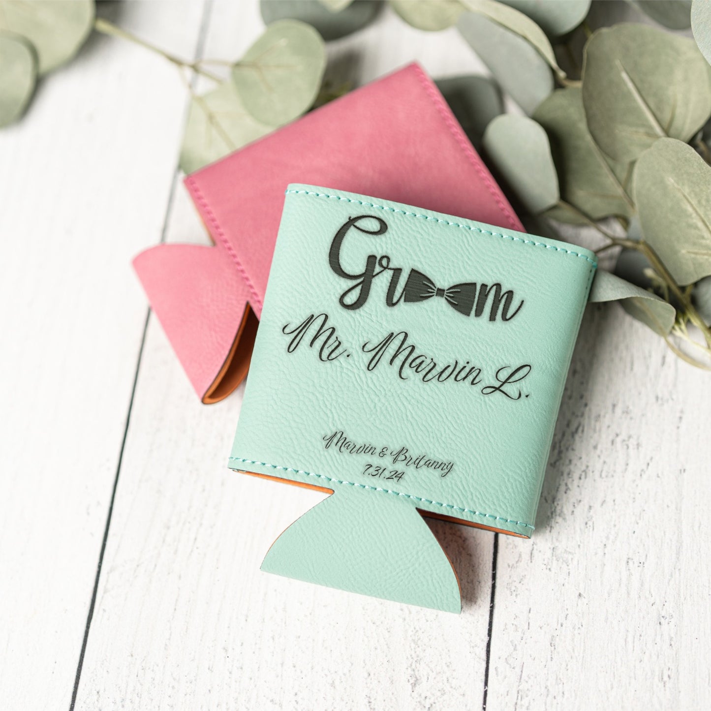 A mint green leather groomsman can cooler with black personalized text reading 'Groom Mr. Marvin L.