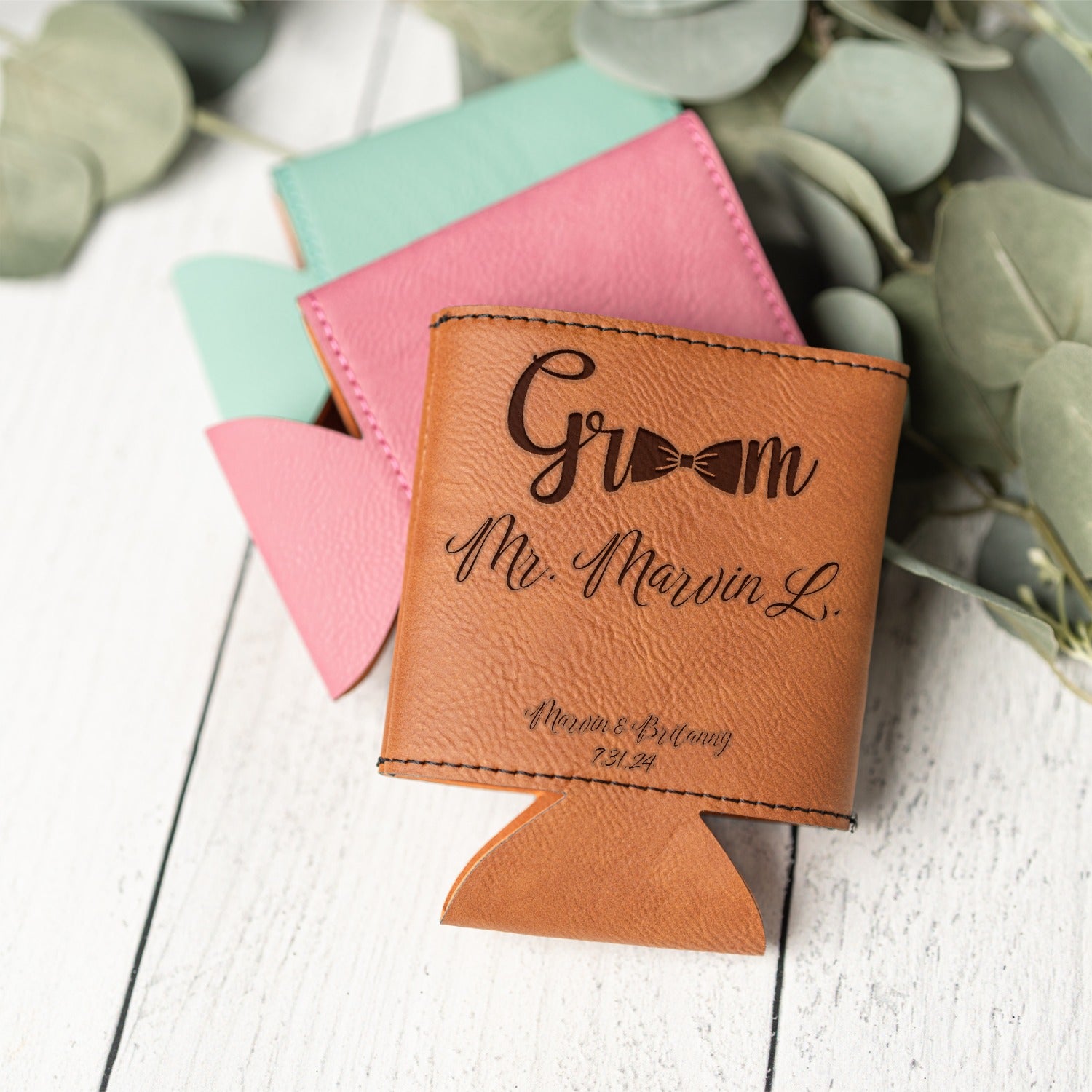 A personalized tan leather can cooler with black script engraving reading 'Groom Mr. Marvin L.