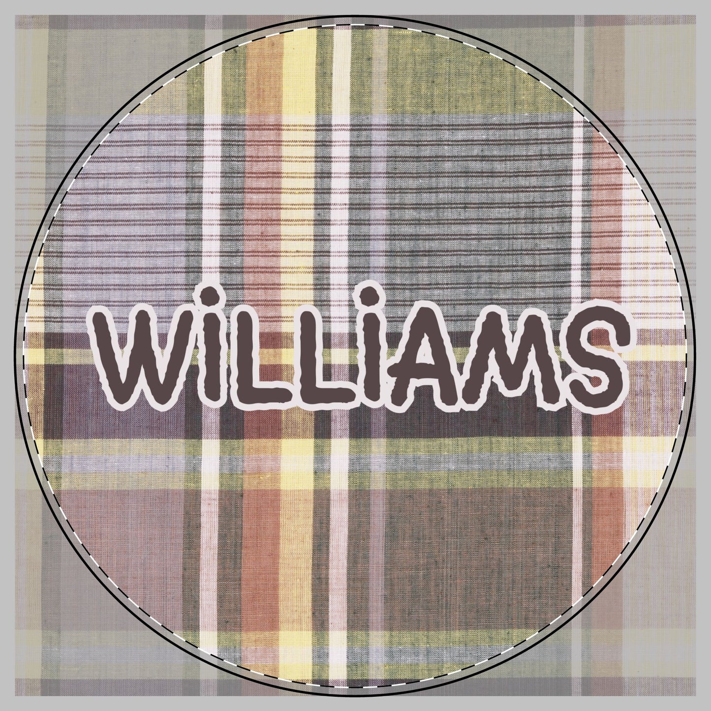 A circular plaid pattern in muted brown, beige, yellow, and gray tones, featuring the name 'WILLIAMS' in dark brown letters with a white outline across the center to be on a cutting board.